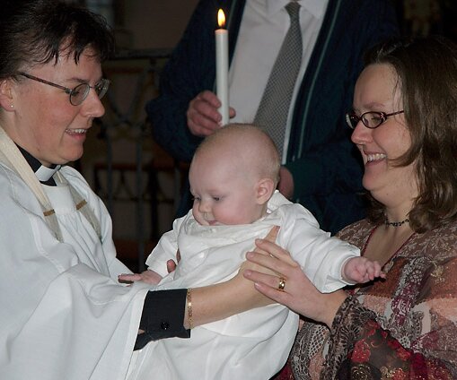 _DSC0036 Handing over a baptized Alice to her mother.