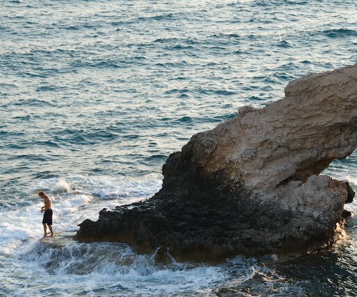 _DSC0100 A guy going swimming at the sea caves area.