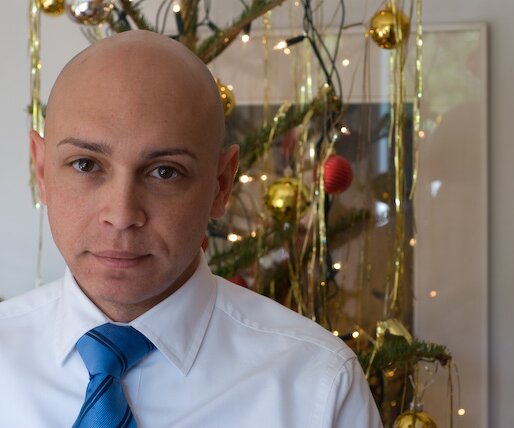 _DSC0008 Markos in front of the Christmas tree.