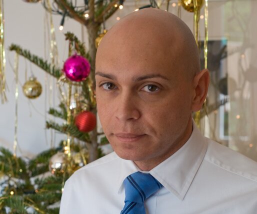 _DSC0010 Markos in front of the Christmas tree.