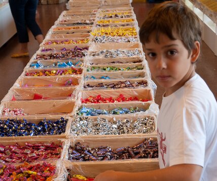 _DSC0001 Andreas buying sweets, at a stop on the way to Denmark.