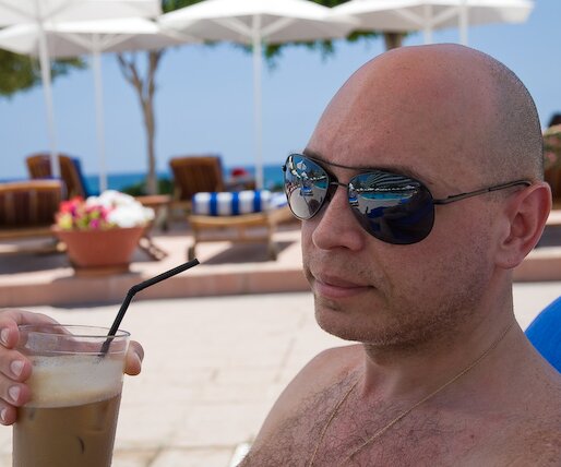 _DSC0028 Markos having a frappé by the pool.
