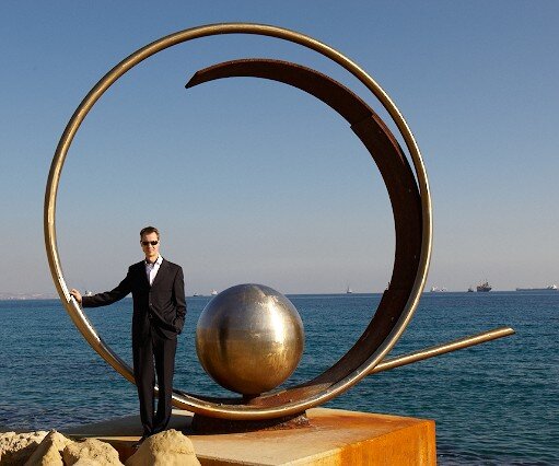 _DSC0163 Arto at a sculpture by the seaside promenade in Limassol.