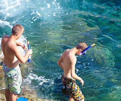 _DSC0027 Boys going snorkeling at the sea caves.