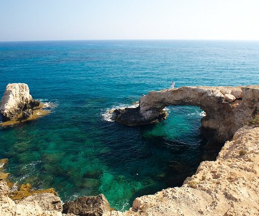 _DSC0039 View at the sea caves area. Markos standing on the natural bridge.