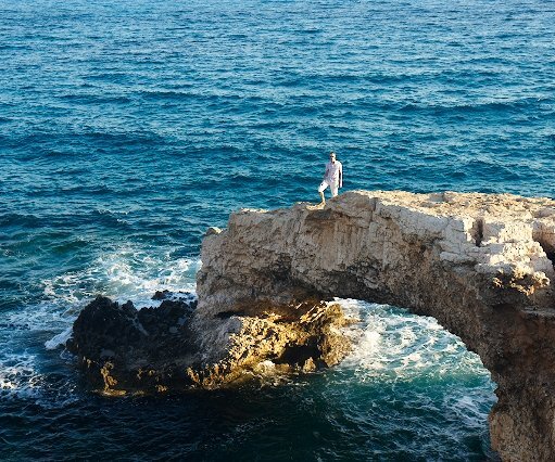 _DSC0100 Arto on a natural bridge at the sea cave.