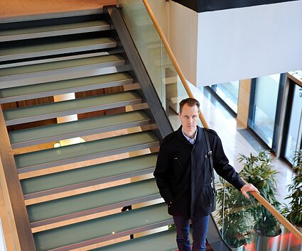 _DSC0044 Arto on the staircase in the lobby area.