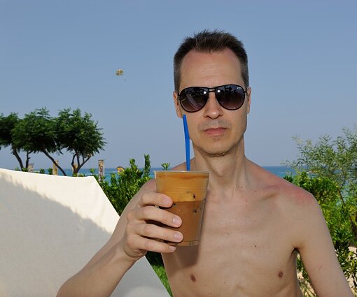 _DSC0037 Arto on the sunlounger having a frappé.