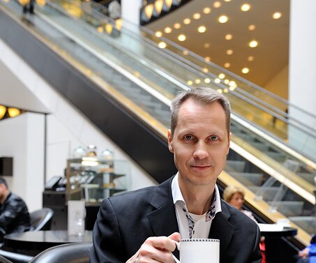 _DSC0019 Arto having cappuccino and croissant at Quartier 206.