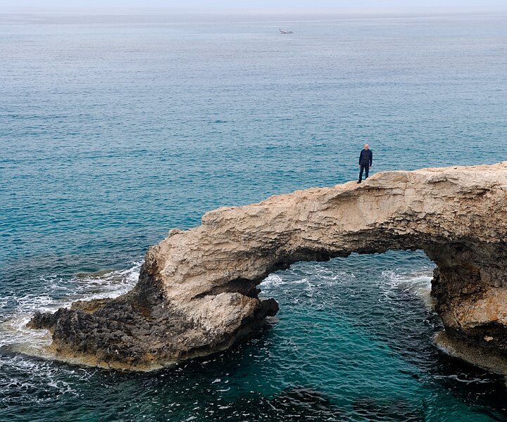 _DSC0035 Markos on the natural bridge over the sea.