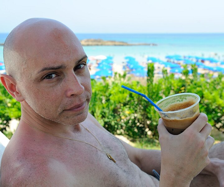 _DSC0003 Markos on the sunlounger drinking frappé.