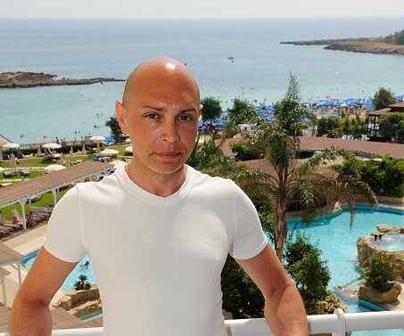 _DSC0006 Markos on the balcony of the hotel room.