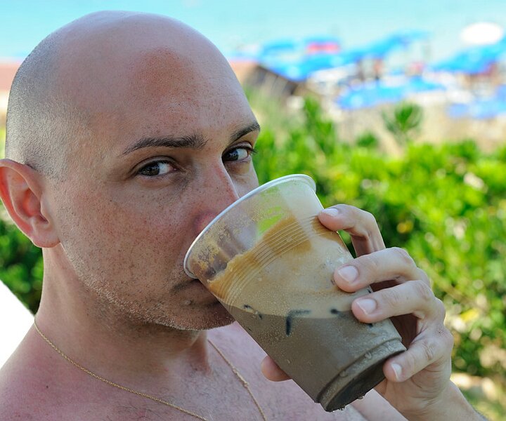 _DSC0007 Markos drinking an ice cold frappé.