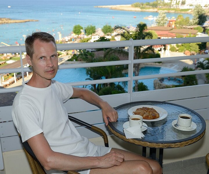 _DSC0036 Arto on the balcony at Capo Bay hotel .