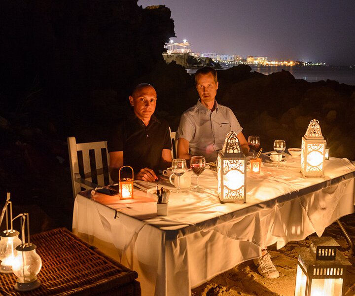 _DSC0066 Markos and Arto having dinner on the beach.