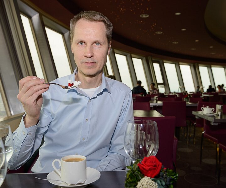 _DSC0098 Arto having dessert in the rotating restaurant Sphere in the TV-tower at Alexanderplatz. At a hight of 207 meters.