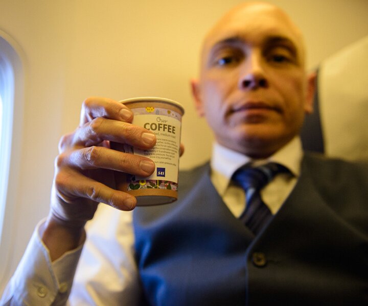 _DSC0020 Markos having coffee on the flight to Berlin.