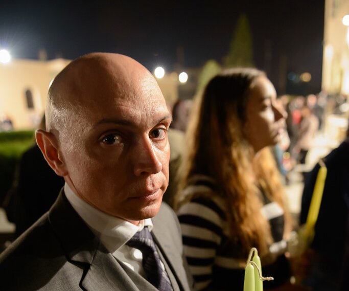 _DSC0050 Markos at church in Limassol at the night of Holy Saturday. Ingrid in the background.