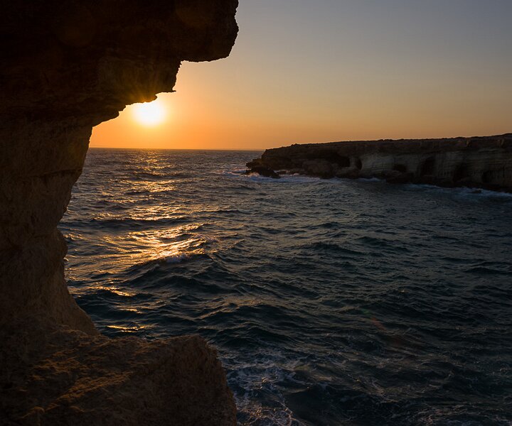 _DSC0062 Sunset from the sea caves at Cavo Greco.
