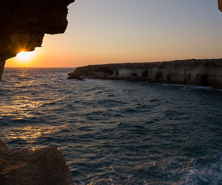 _DSC0068 Sunset from the sea caves at Cavo Greco.