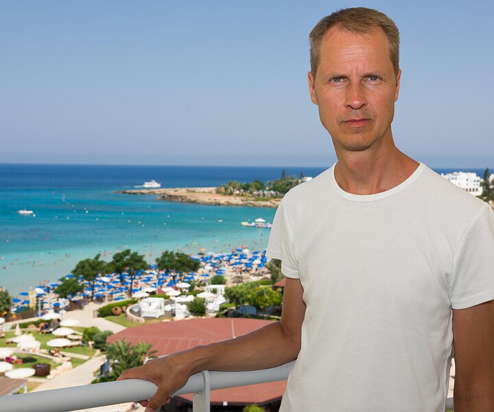 _DSC0103 Arto on the balcony of the room at Capo Bay hotel.