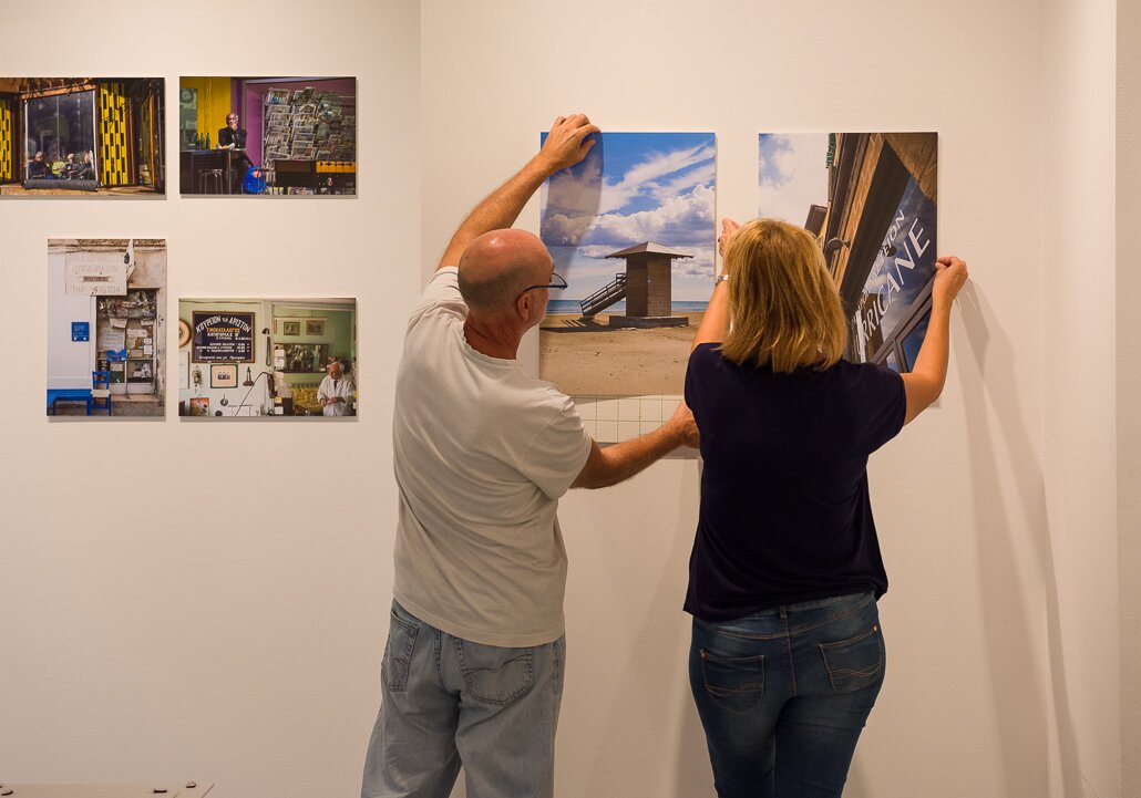 Preparation of a photo exhibition Nicos and Anna preparing their photo exhibition.