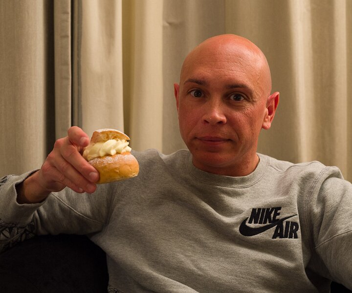 _DSC0697 Markos enjoying a semla at the hotel room in Stockholm.