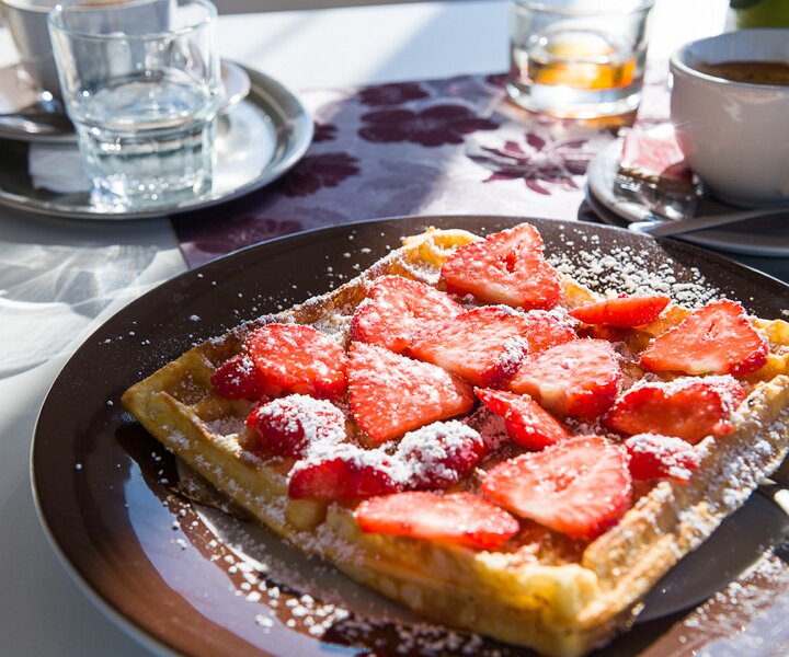 _DSC2713 Having a delicious waffle with strawberries and coffee.