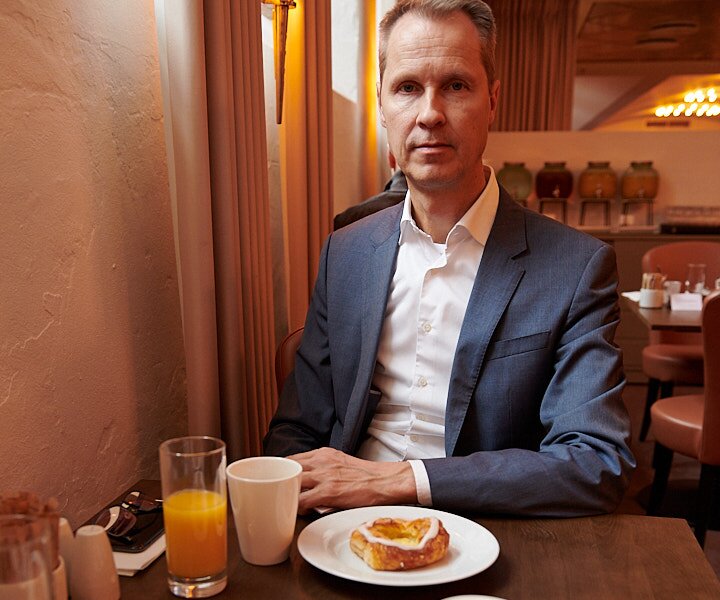 _DSC0999 Arto having breakfast with Danish pastries and croissants at the hotel in Copenhagen.