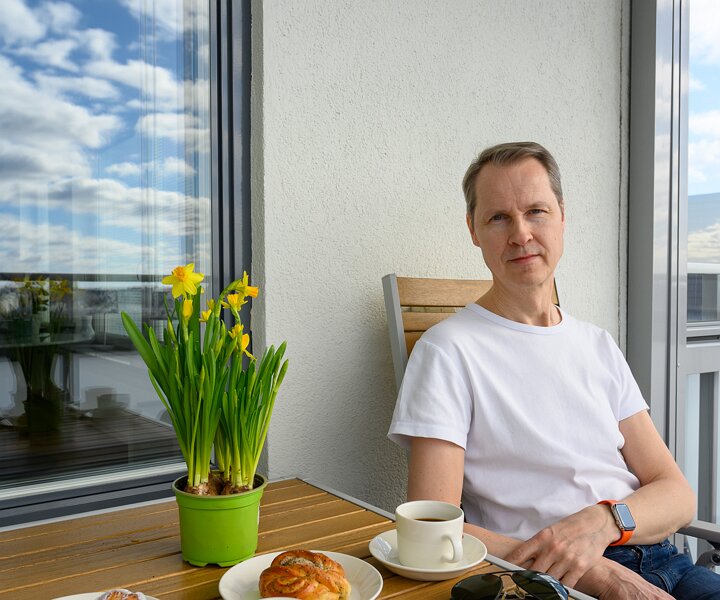 _DSC1583 Arto having morning coffee on the balcony.