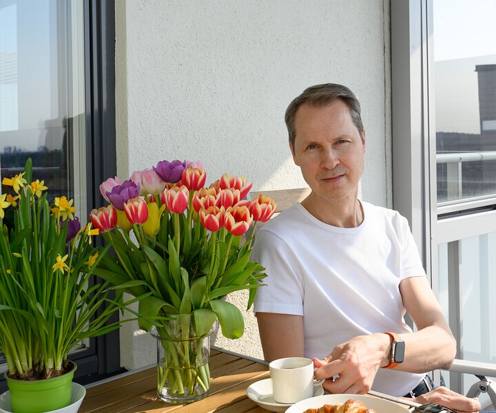 _DSC1789 Arto having morning coffee on the balcony.