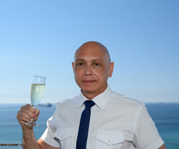 _DSC5183 Markos on the balcony of the hotel room in Limassol, celebrating birthday with bubbles.