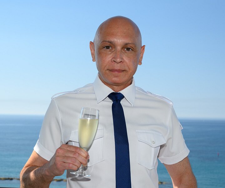 _DSC5185 Markos on the balcony of the hotel room in Limassol, celebrating birthday with bubbles.